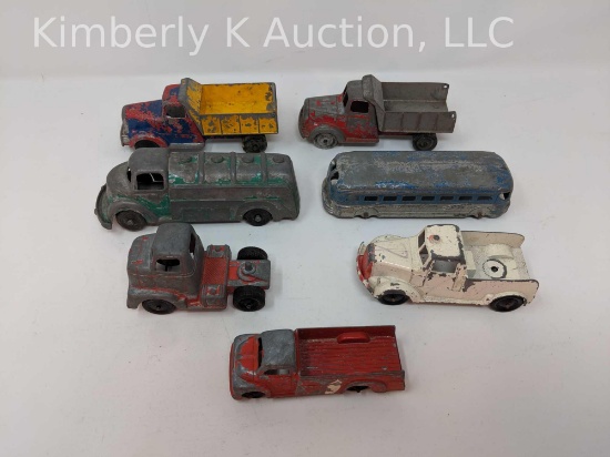 7 Cast metal toy trucks, bus