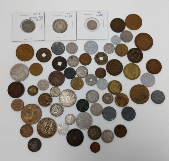 63 Foreign coins including 1830 25-cent Netherlands, (2) Cuba 1916 (some silver)