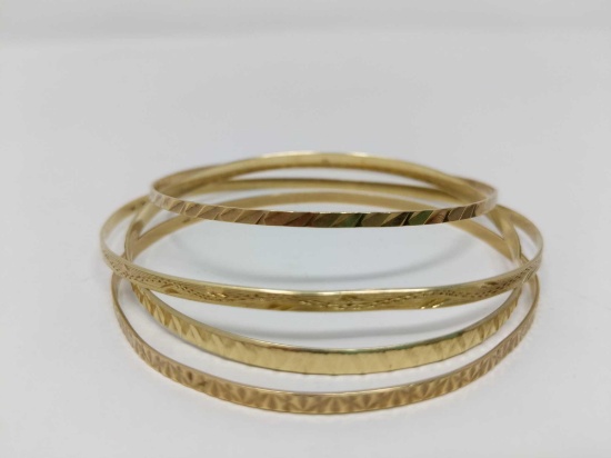 Four Gold Bangle Bracelets