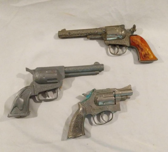 Three Toy Revolvers