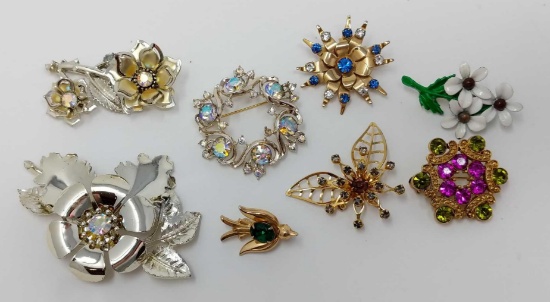 Eight Costume Brooches