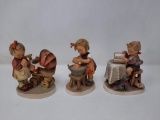 3 Hummels - Doll Bath, 319; Girl Praying with Baby Carriage, 67; Boy Reading Book by Table, 206