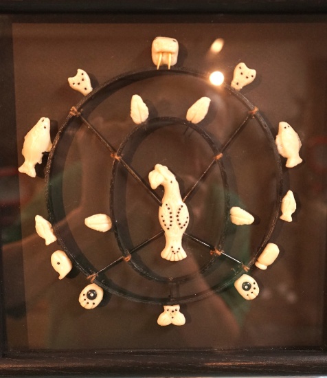 Frame of Eskimo Hand Carved Ivory Animals and Fishing Carvings