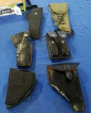 5 Pistol Holsters and 1 Double Clip Holder.