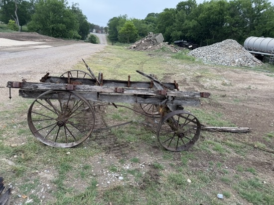 Antique wagon chassis, steel wheels and axles.