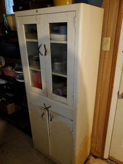 white metal cabinet with contents