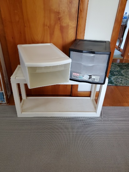 Two Storage Containers and A Plastic Table