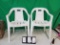 2 white patio chairs