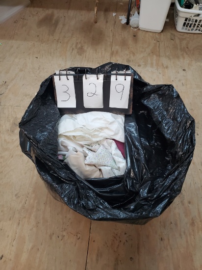 trash bag full of linens