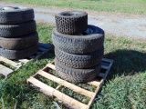 3 LT235/85/r16 tires on rims and an atv tire