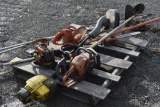 pallet with Husqvarna polesaw parts, chainsaw parts, pruner, and electric hedge trimmers