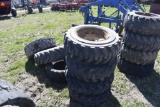 4 10-16.5 skidsteer tires on 8 lug rims along with 3 misc tires