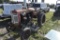 Farmall 130 tractor with Woods Belley mower