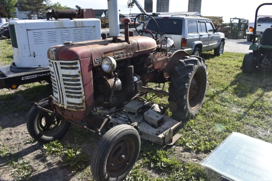 Farmall 130 tractor with Woods Belley mower