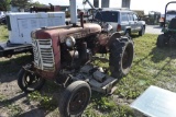 Farmall 130 tractor with Woods Belley mower