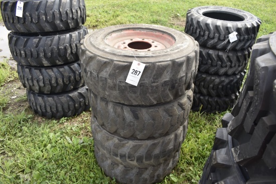 4 titan 10-16.5 skidsteer tires on 8 lug rims