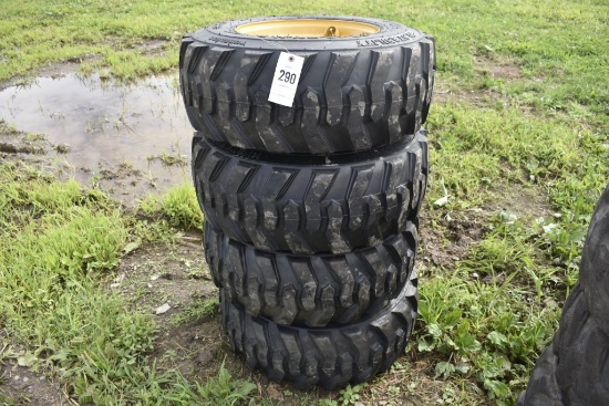 4 new forerunner 12-16.5 skidsteer tires on 8 lug yellow rims