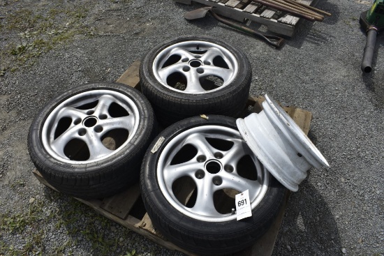 3 Porsche Wheels and 1 Trailer Rim