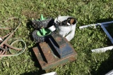 wheels, bucket of oil cans, boxes of tools