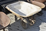 white wheel barrow with two front wheels