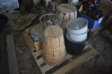 pallet with fruit baskets, wire basket, and buckets