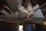 Contents of rafters in second floor of gray building across the street from the red barn