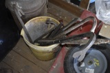 bucket with big screwdriver, multiple pry bars, wire brushes etc