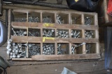 wooden organizer full of bolts