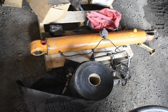 Roll of Black Plastic, Big orange hydraulic cylinder, fuel relays, seeder, etc