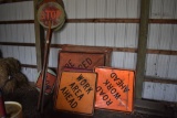 7 Square road signs and 4 road crew stop signs with caution flags
