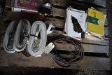 4 Ratchet straps with out hooks, transmission manuals and tractor manuals, and electric cord