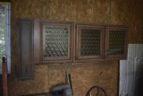 4 door cabinet with glass in it on wall