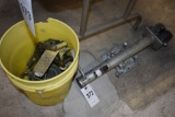 Yellow bucket with two load straps and a trailer jack for a boat