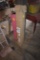 Partial roll of heavy plastic and roll of pink packing plastic