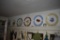 All plates hanging from walls and on shelves