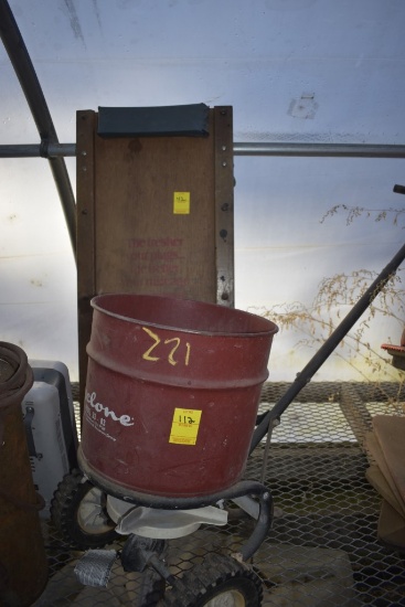 Cyclone model 33 lawn Spreader and Champion Creeper that’s missing a wheel