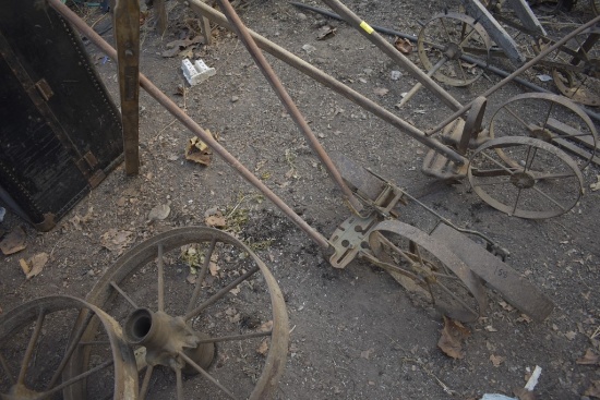 Antique push shear, wheels to an old planter and McCormick Deering handles