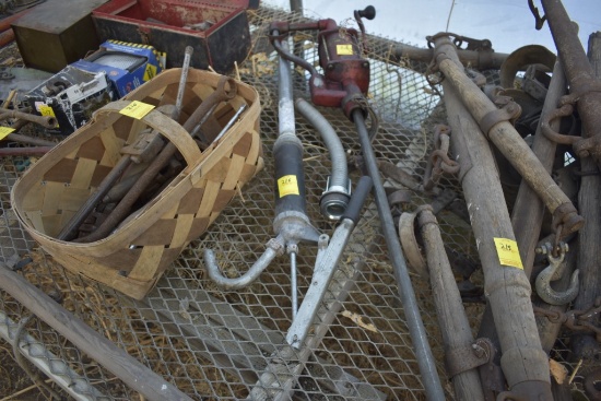 Pennzoil pump, grease barrel pump and basket with some tools in it