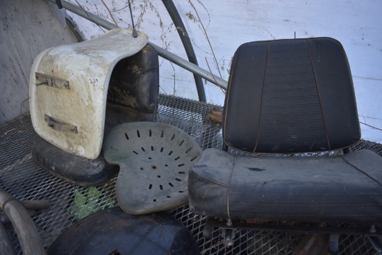 two old tractor seats with upholstered tractor seat and two misc seats