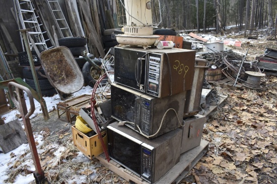 pallet of microwaves, toolboxes, kerosene heater, etc