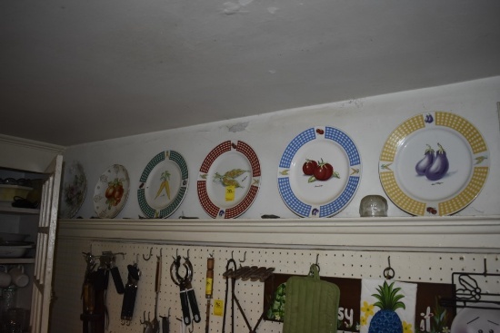 All plates hanging from walls and on shelves