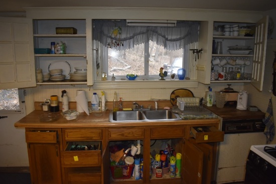 All kitchen related items under and above sink in cupboards and drawers