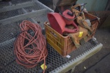 crate with sander and various other tools and extension cord