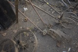 Antique push shear, wheels to an old planter and McCormick Deering handles