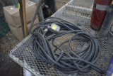 4 Plug 120 Volt extension cord and rock rake, mop and leaf rake