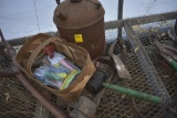 Antique oil can, basket of garden tools, tree climbing spikes, mallet