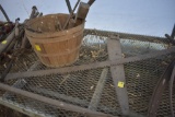 2 old saws and basket with cast iron ladle, blacksmith tongs, old wrench etc