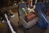 Blue Upholstered truck seat with gas can and vintage crate