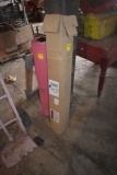 Partial roll of heavy plastic and roll of pink packing plastic