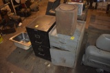 black 2 drawer filing cabinet, blue cabinet, and bin of baking soda
